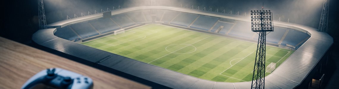 Leeres Fußballstadion unter Flutlicht, im Vordergrund ein Gamecontroller auf einem Tisch