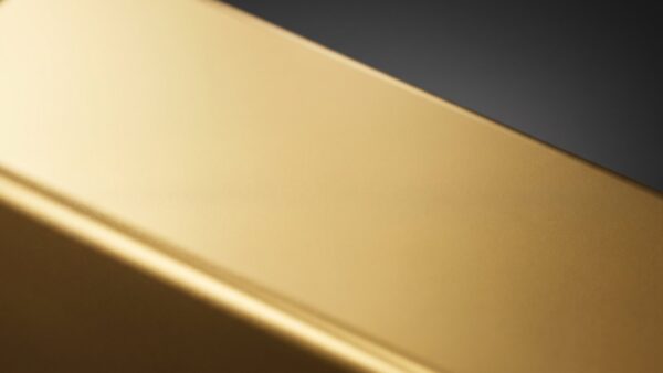 gold etf bild 1 Nahaufnahme der glatten Oberfläche eines goldfarbenen Barrens